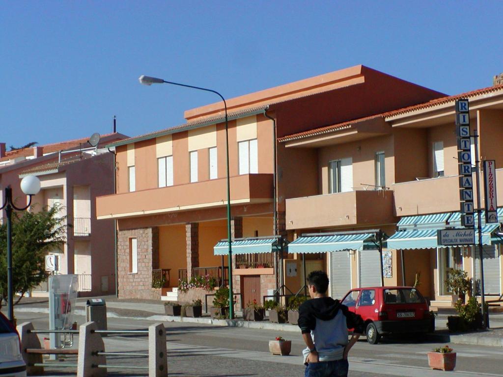 Borgo Spiaggia Vista Mare Isola Rossa Habitación foto