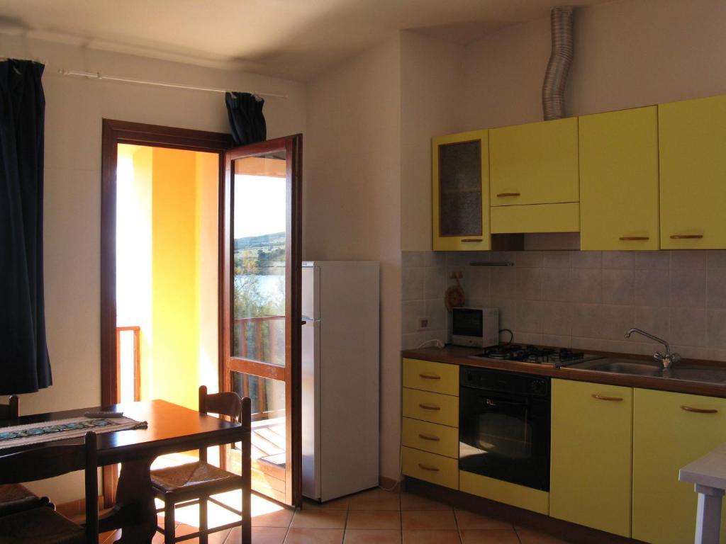 Borgo Spiaggia Vista Mare Isola Rossa Habitación foto